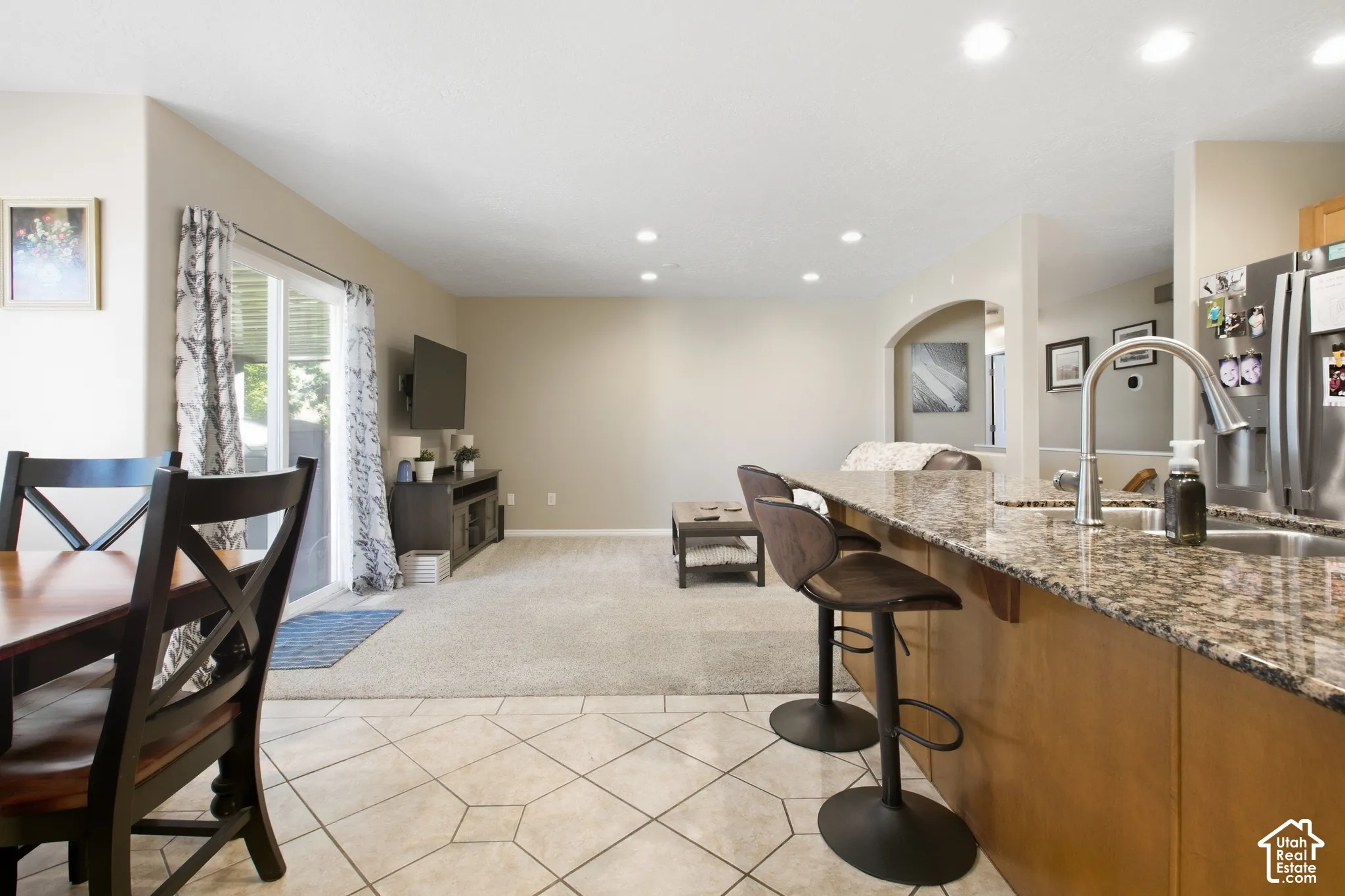 Kitchen island with granite countertop and stainless steel sink