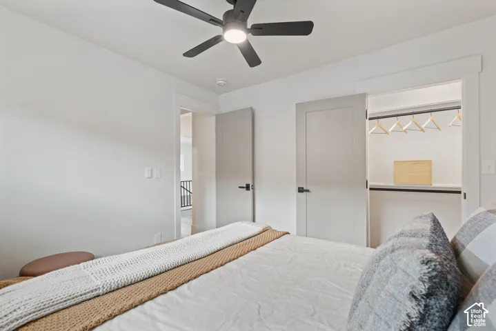 Recessed lighting, ceiling fan with integrated lighting, built-in closet shelving, and modern interior doors with dark hardware