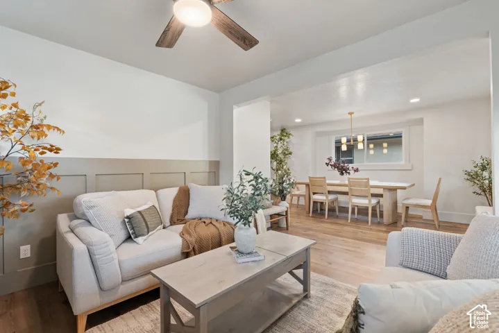 Wood-finish flooring, recessed lighting, and a ceiling fan