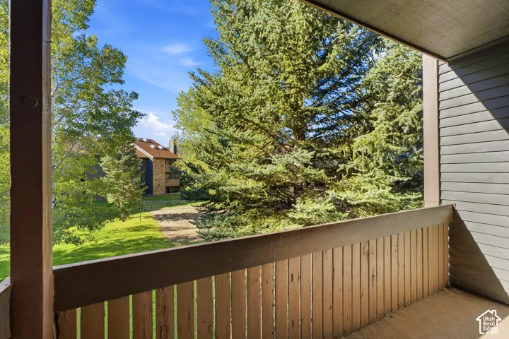 Private balcony with a slatted wood railing