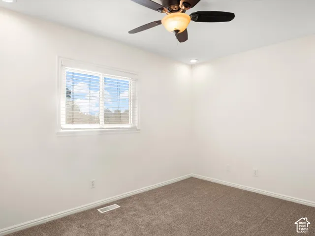 Recessed lighting, ceiling fan with integrated light, horizontal window blinds, and neutral carpet flooring