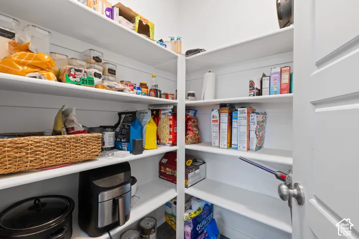 Integrated pantry shelving with clean white finishes