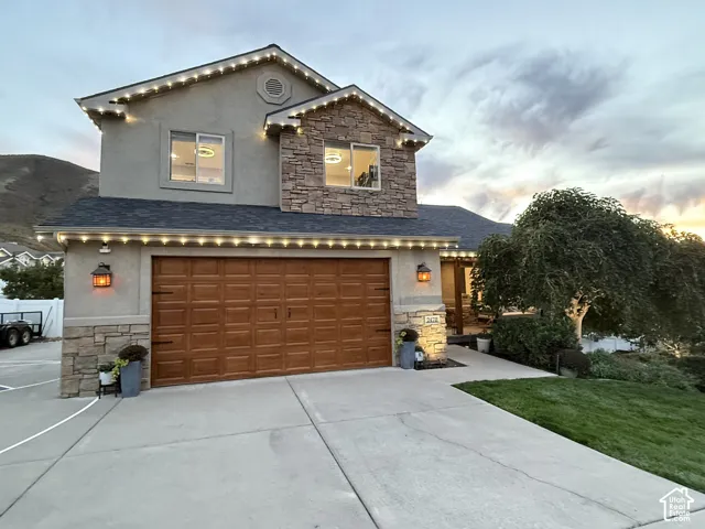 Stucco and stone exterior with architectural shingles