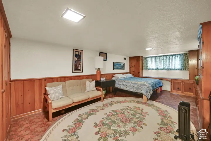 Recessed lighting and wood-paneled walls