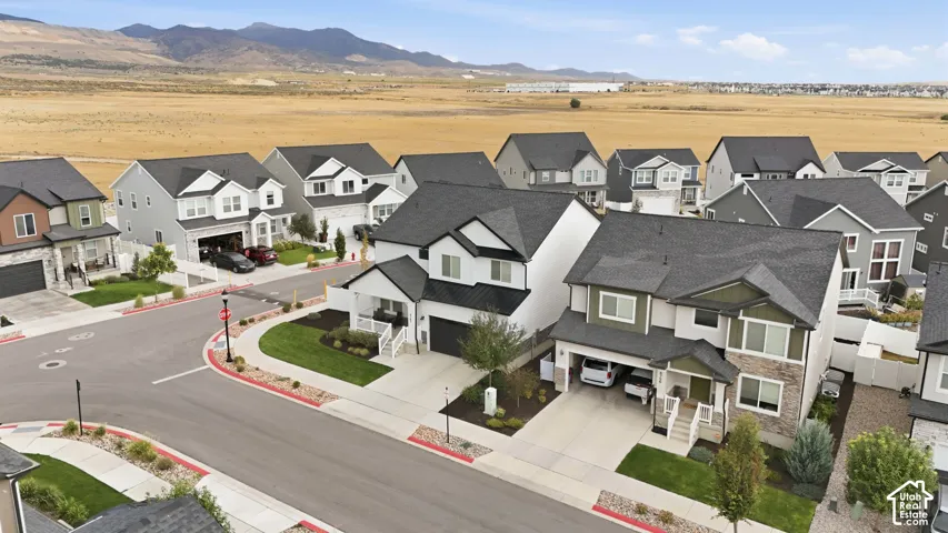 Residential community featuring contemporary architectural styles, paved roadways, and landscaped front yards