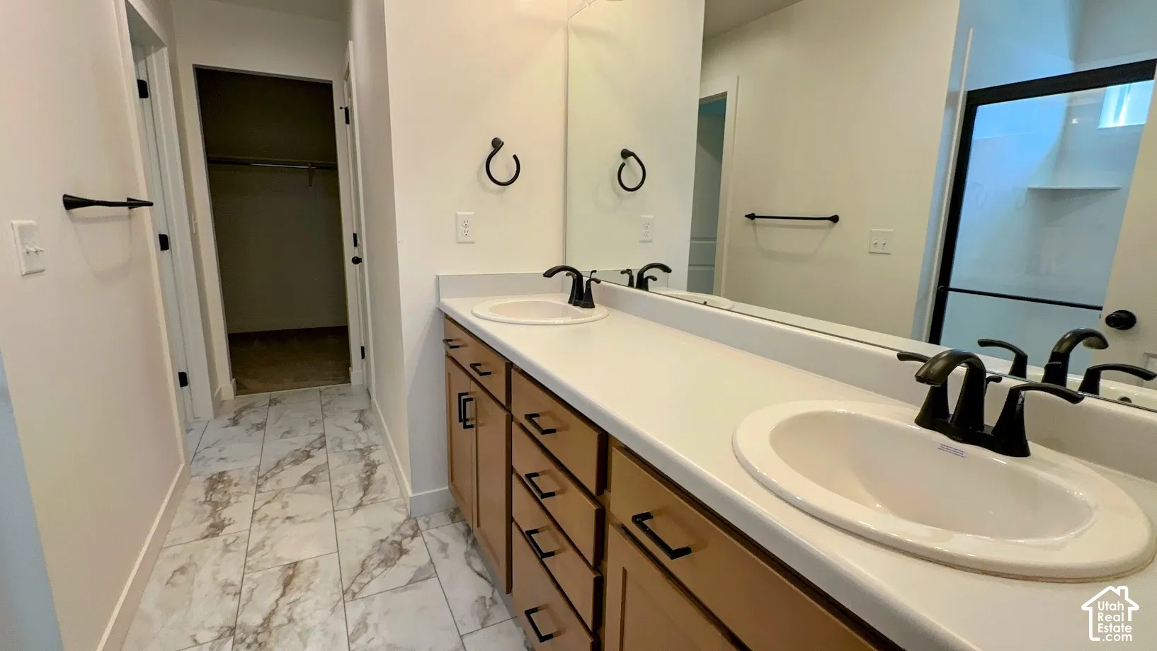 Dual vanity with integrated sinks and matte black fixtures