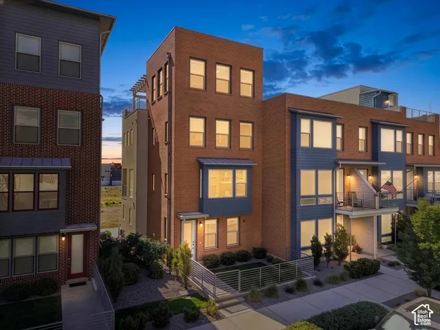Contemporary multi-story exterior with brick and siding facade