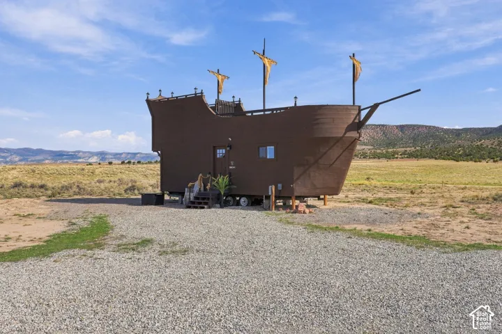 Unique ship-themed exterior with decorative masts and sails