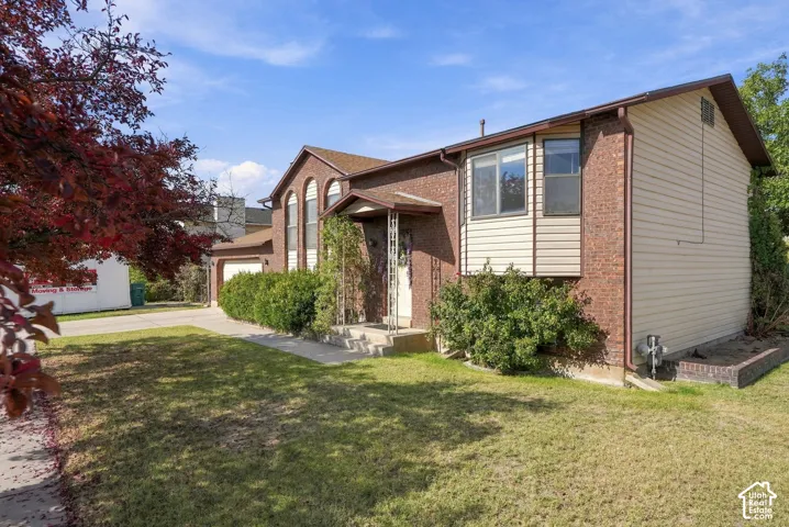 Brick and siding exterior with a pitched roof