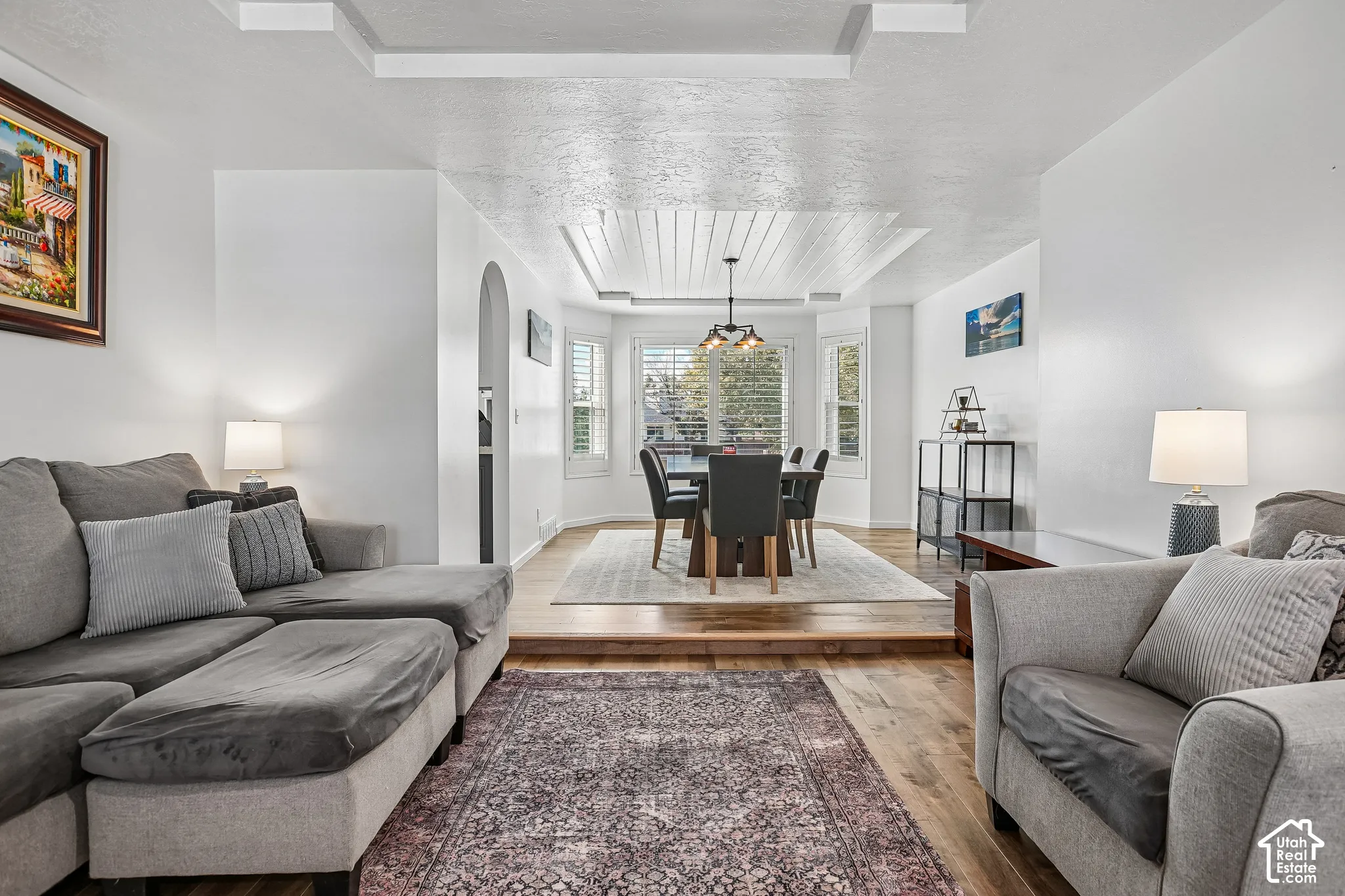 Wood-finish flooring throughout, featuring a multi-level layout with a dining area