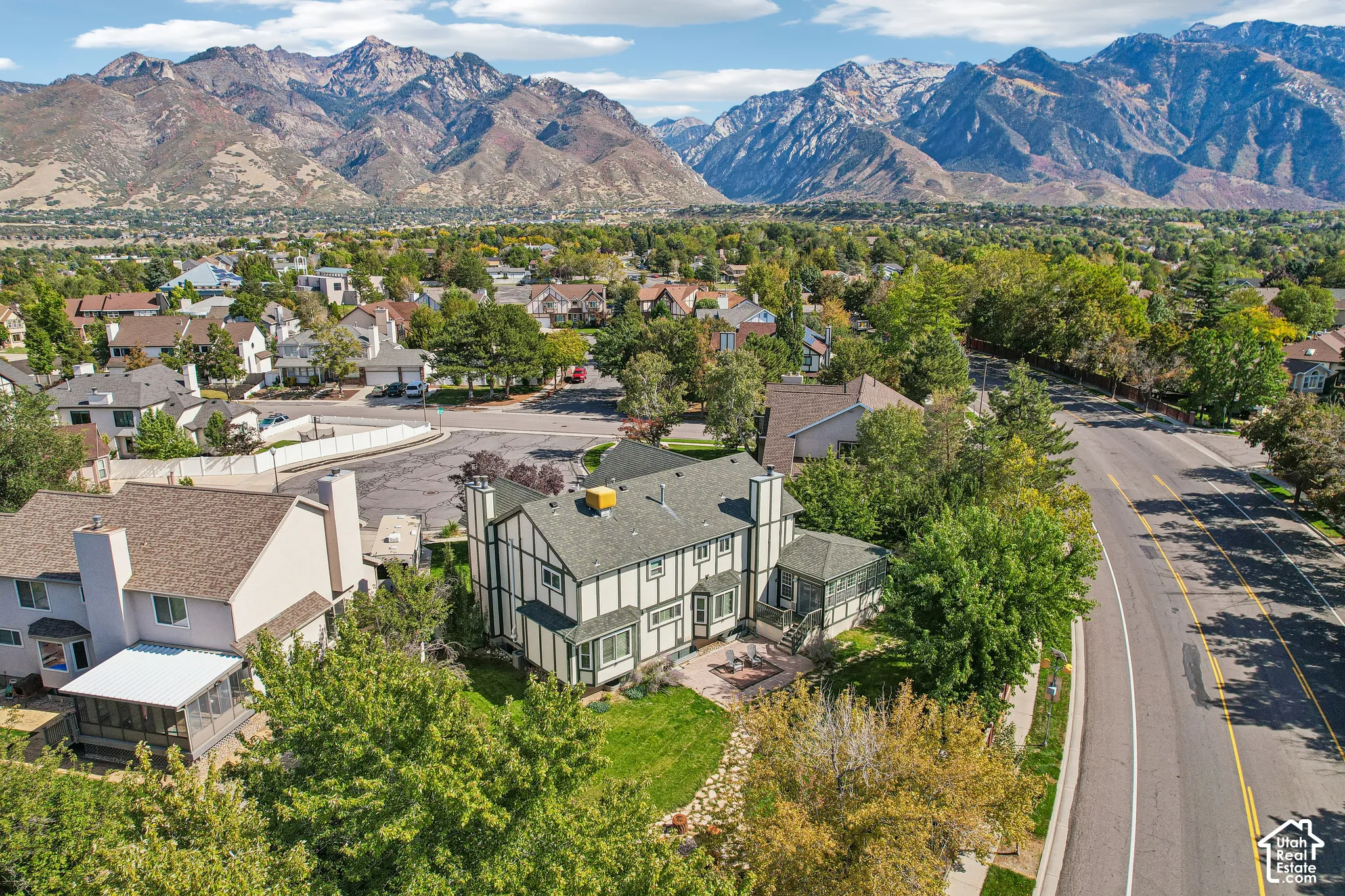 Tudor-style residence with a distinct exterior, featuring a multi-level design and a prominent chimney structure
