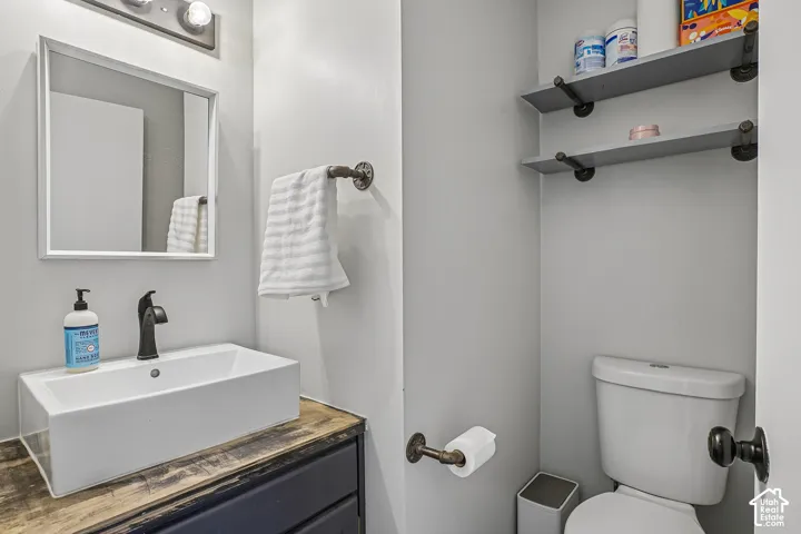 Modern rectangular vessel sink with a matte black faucet, set on a wood-finish vanity countertop