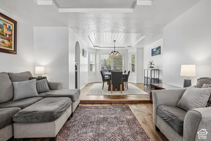 Wood-finish flooring throughout, featuring a multi-level layout with a dining area