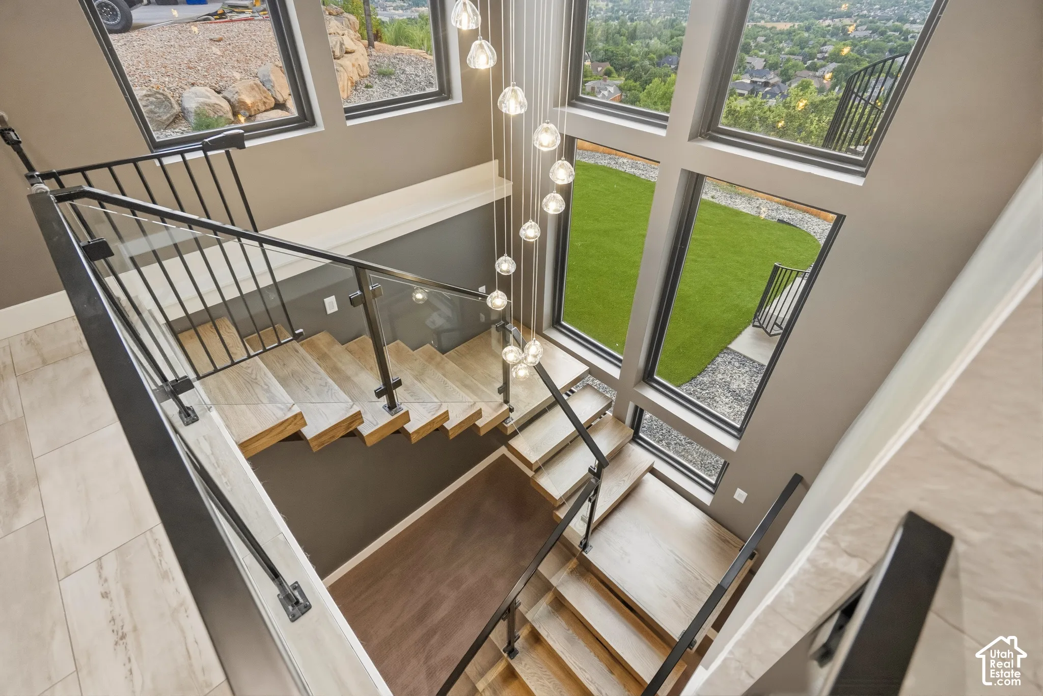 Multi-level staircase with light wood-finish treads and risers