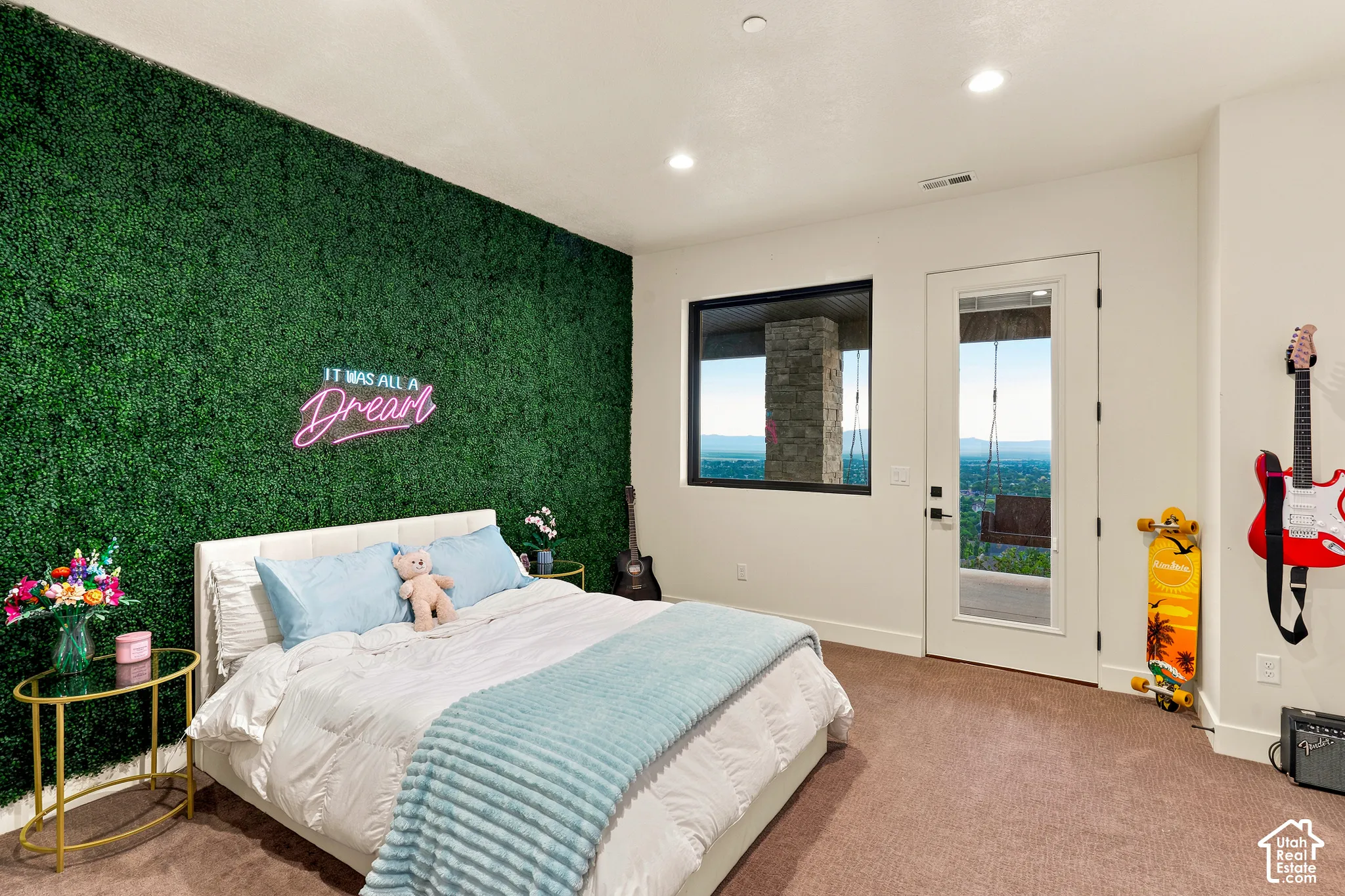 Textured accent wall, recessed lighting, and a full-light exterior door