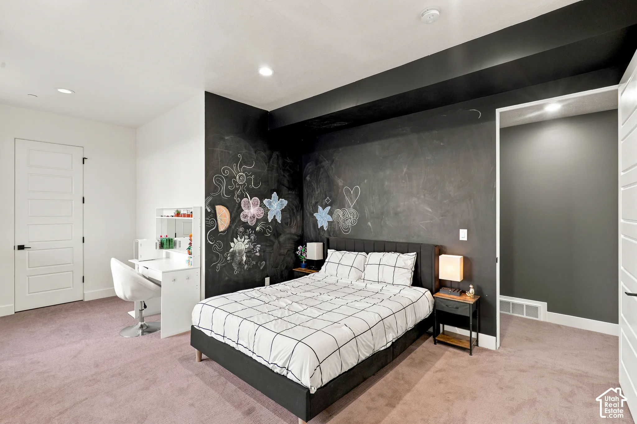 Recessed lighting, chalkboard accent wall, five-panel interior doors with black hardware, plush carpeting, built-in shelving