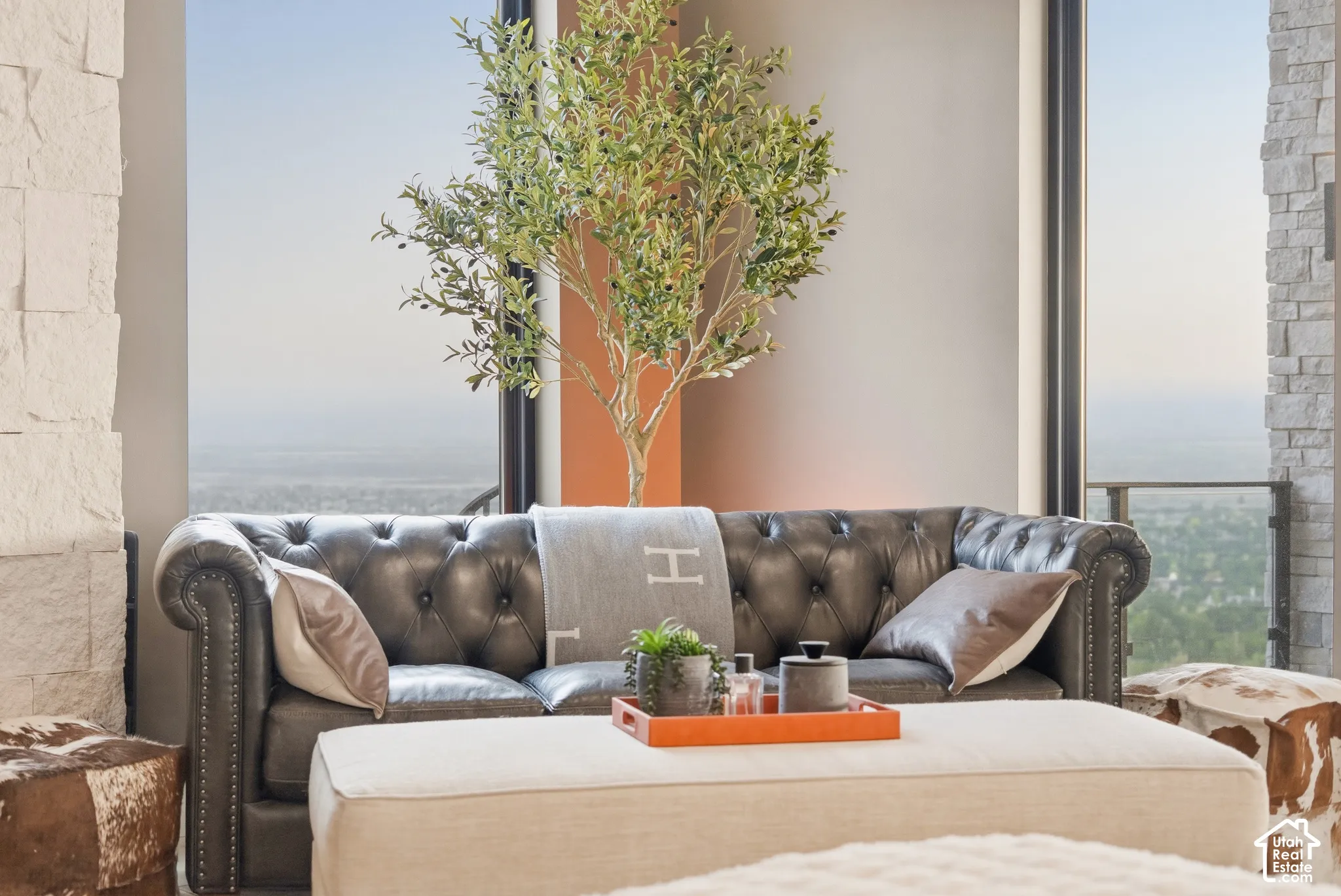 Full-height windows with a metal frame, offering expansive outdoor scenery