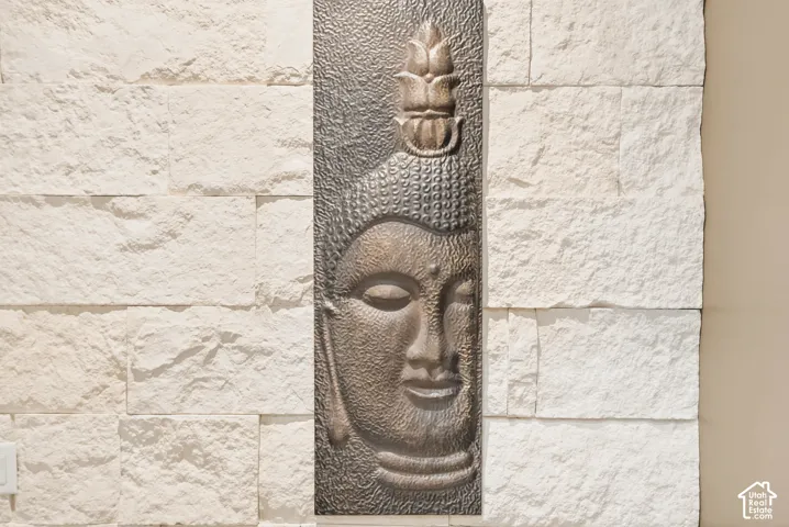 Stacked stone accent wall with a rectangular decorative panel
