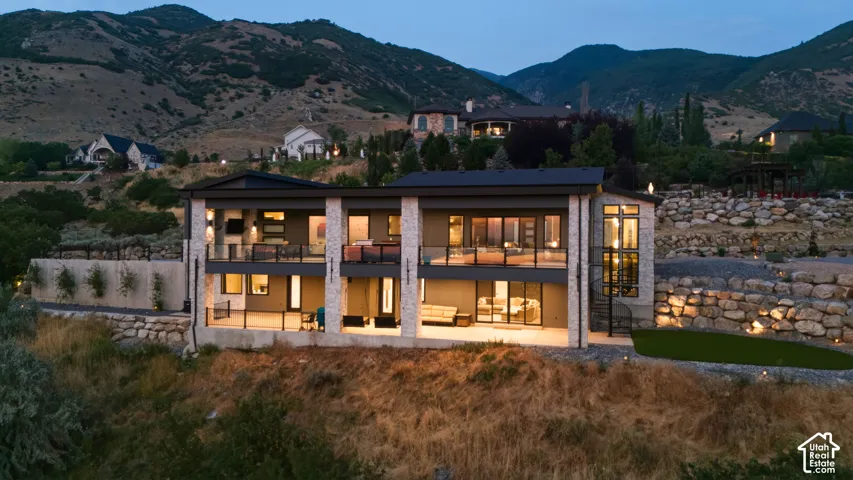 Contemporary exterior with stone facade and multiple balconies