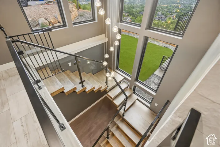 Multi-level staircase with light wood-finish treads and risers