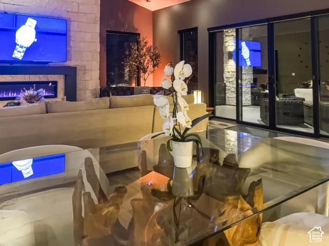 Stone-clad fireplace with a built-in linear electric insert