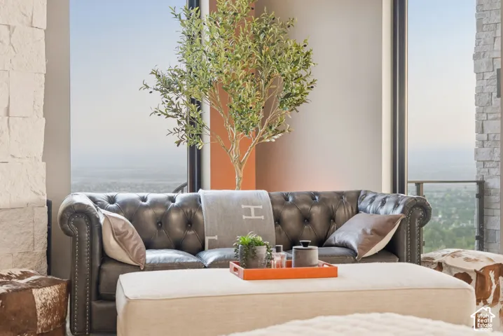 Full-height windows with a metal frame, offering expansive outdoor scenery