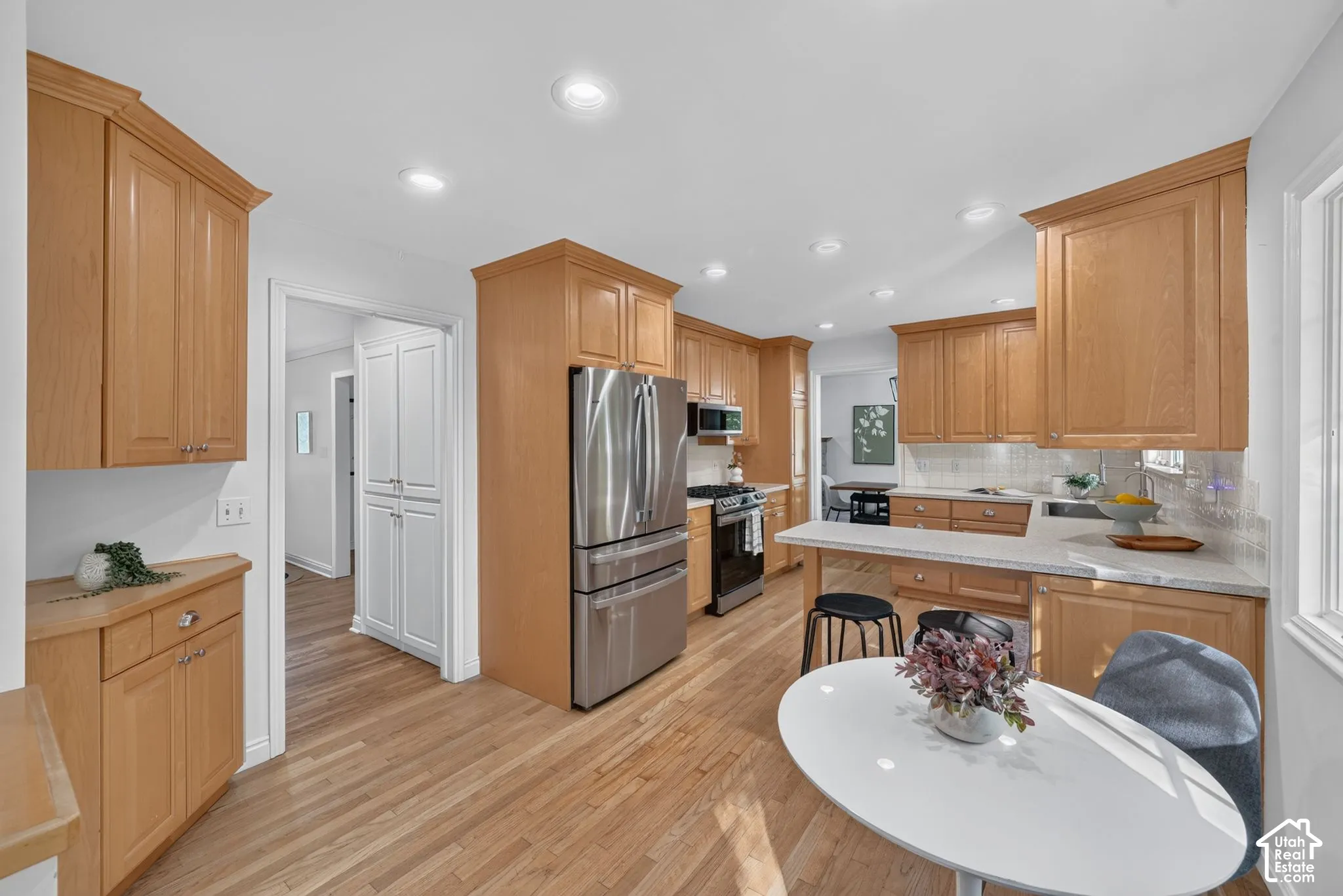 Updated kitchen with recessed lighting and generous counter space.