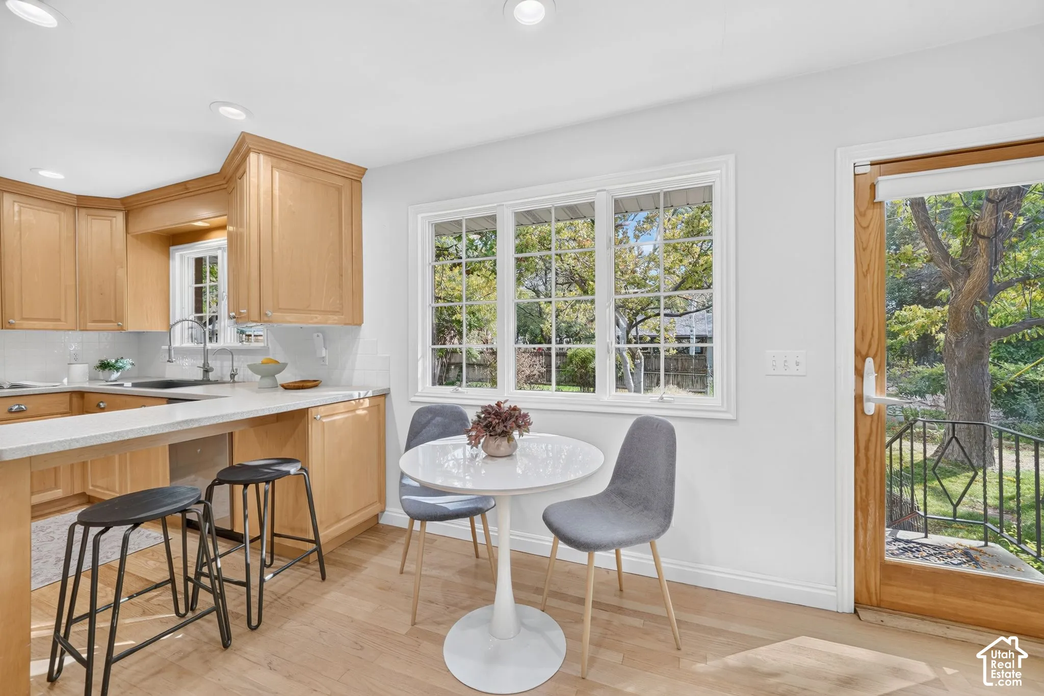 Breakfast nook with a door to the backyard.