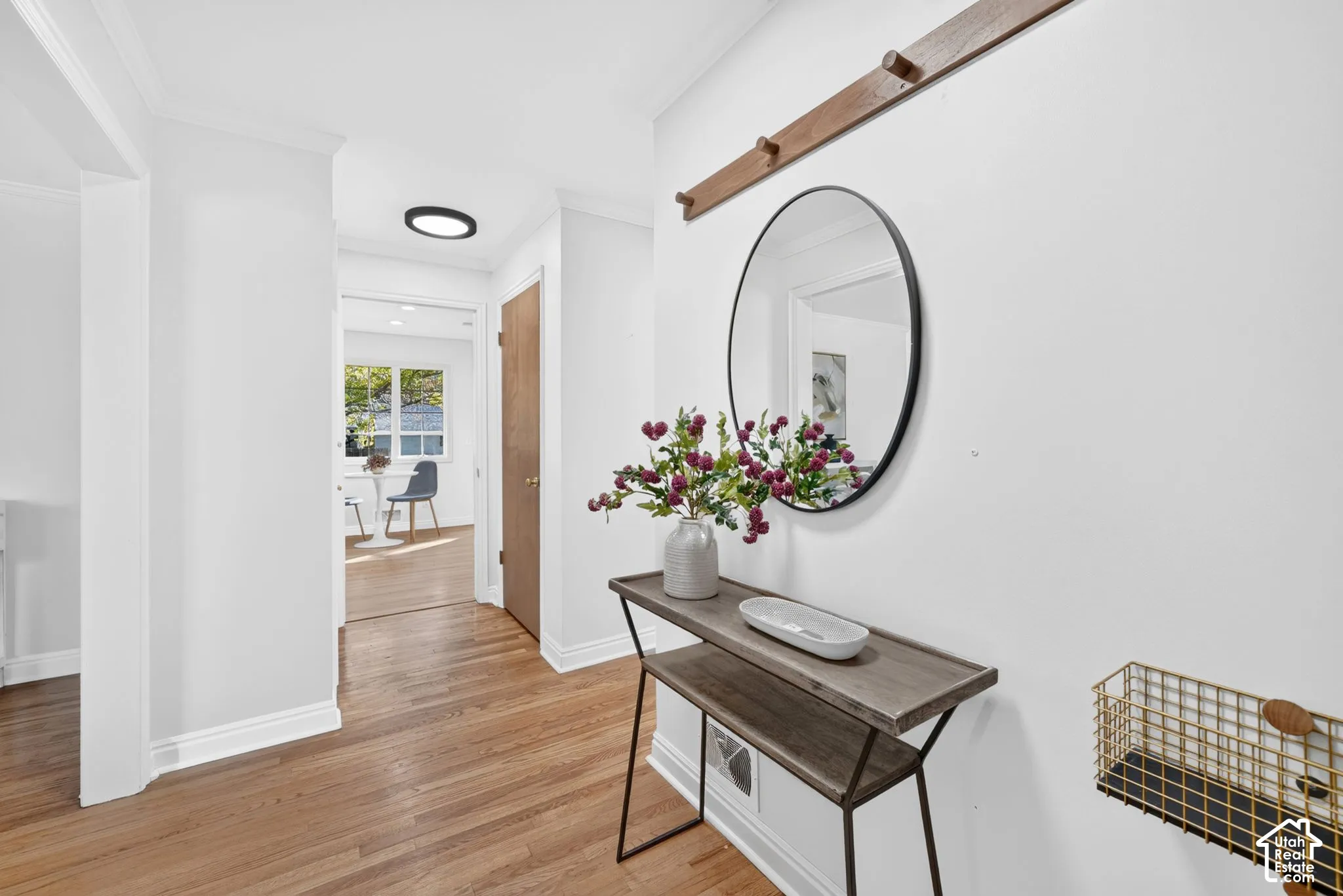 Entry foyer with hardwood floors and a sightline to the breakfast nook.