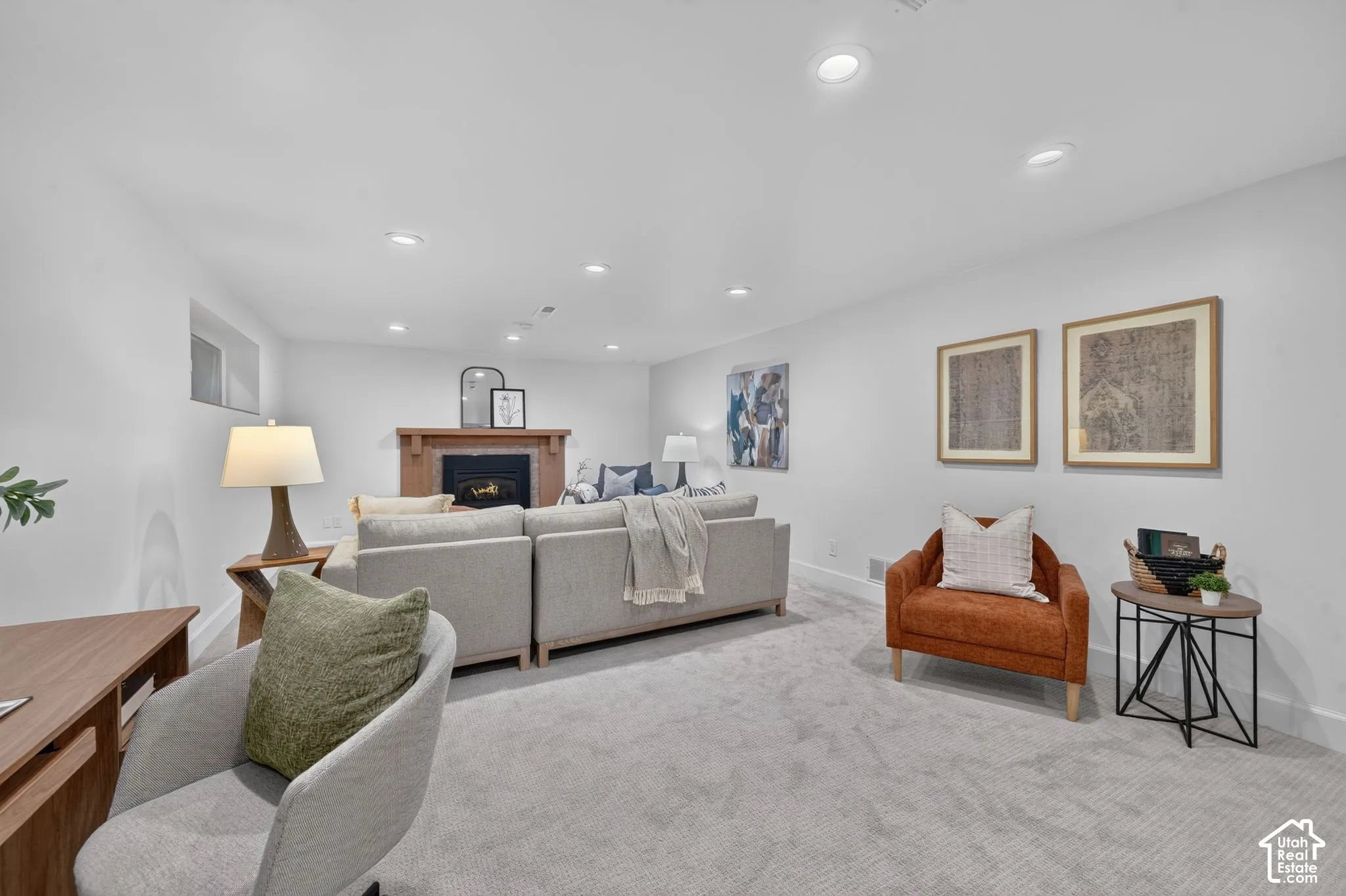Lower family room with a second gas fireplace. Part of a walk-out basement with ADU potential.