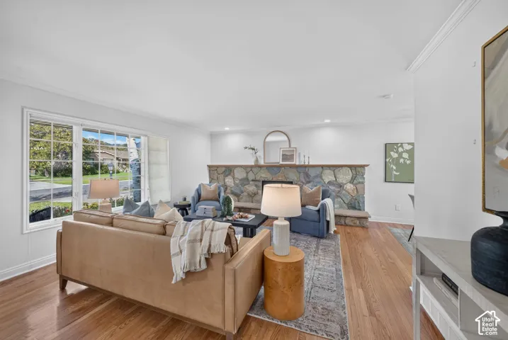 Living room with a large picture window and gas fireplace.
