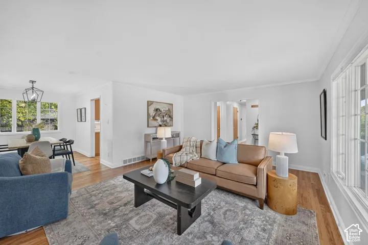 Open living and dining with hardwood floors.