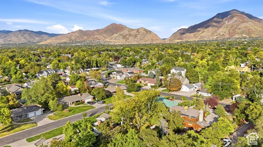 Mountain views and mature tree canopy in a sought-after Millcreek pocket.
