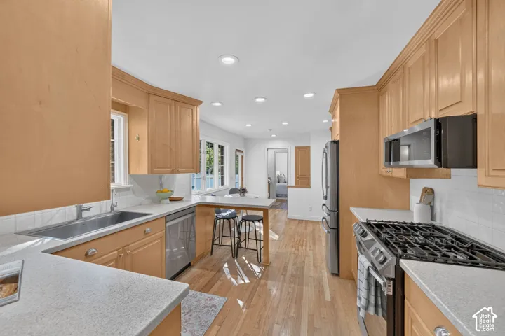 Gas range, built-in dishwasher, and a double sink.