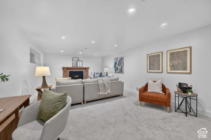 Lower family room with a second gas fireplace. Part of a walk-out basement with ADU potential.