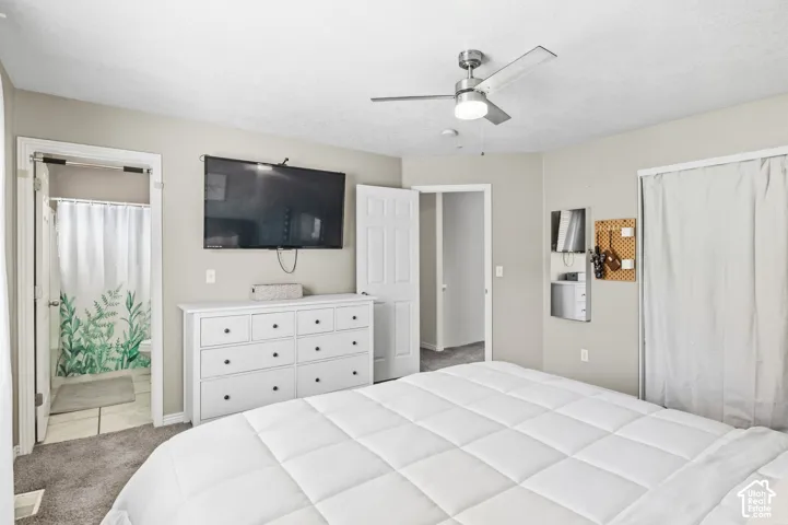 Recessed lighting, ceiling fan, and carpeted flooring