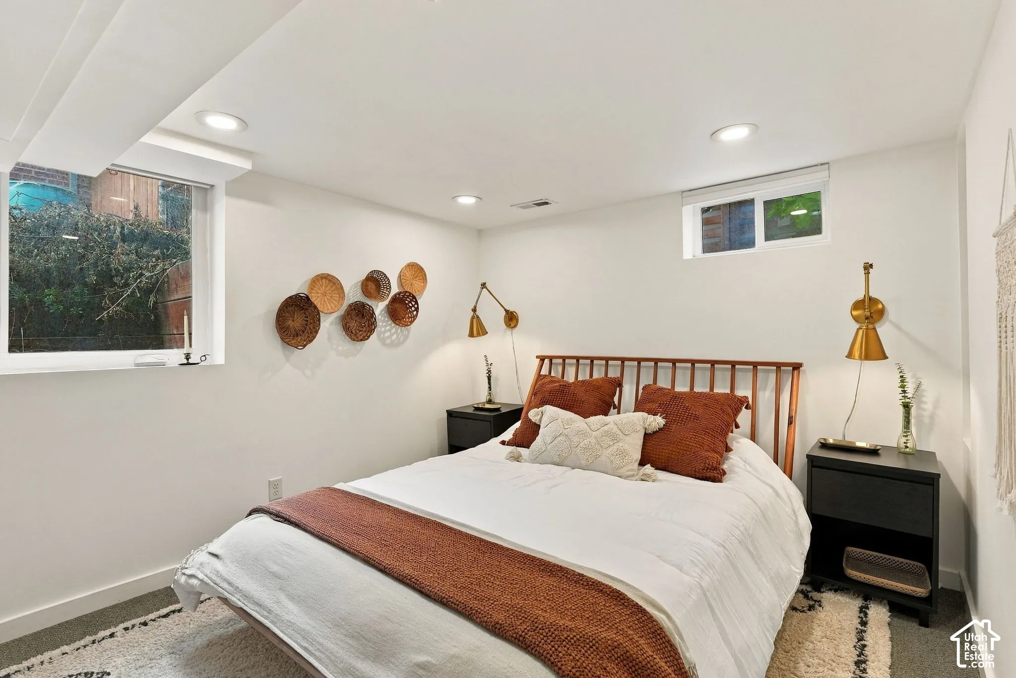 Recessed lighting, two windows, and built-in wall sconces