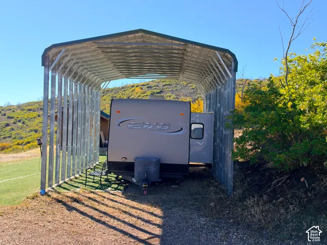 Metal carport structure with a gabled roof
