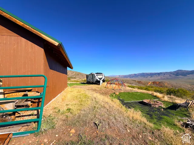 Brown exterior structure with green trim