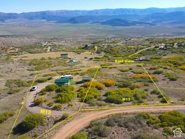 Expansive lot with varied terrain and established dirt roads