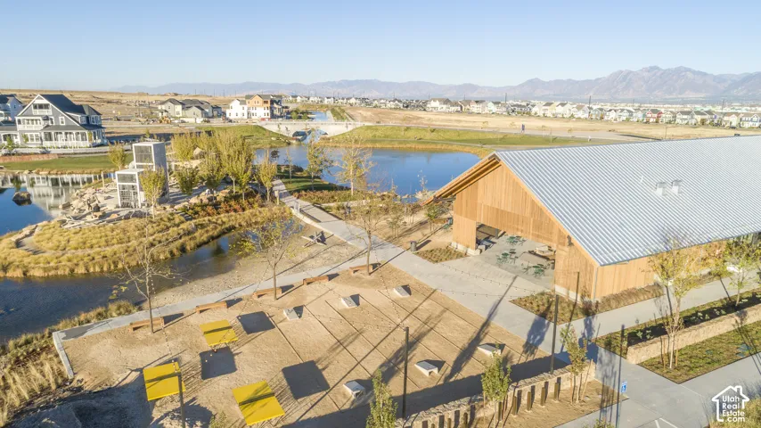 Water feature with surrounding landscaping and a bridge