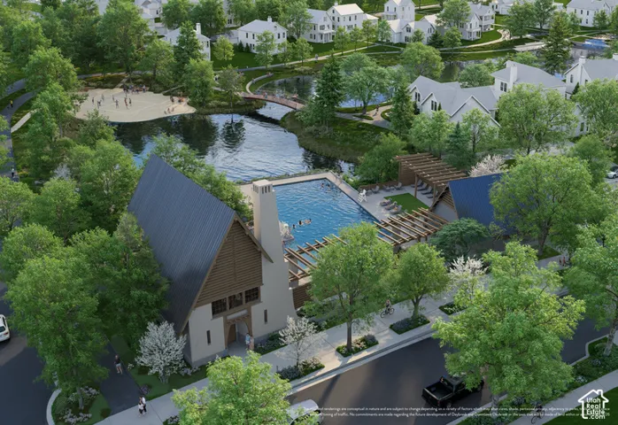 Community amenities featuring a swimming pool, expansive water body, sand beach area, and pedestrian pathways