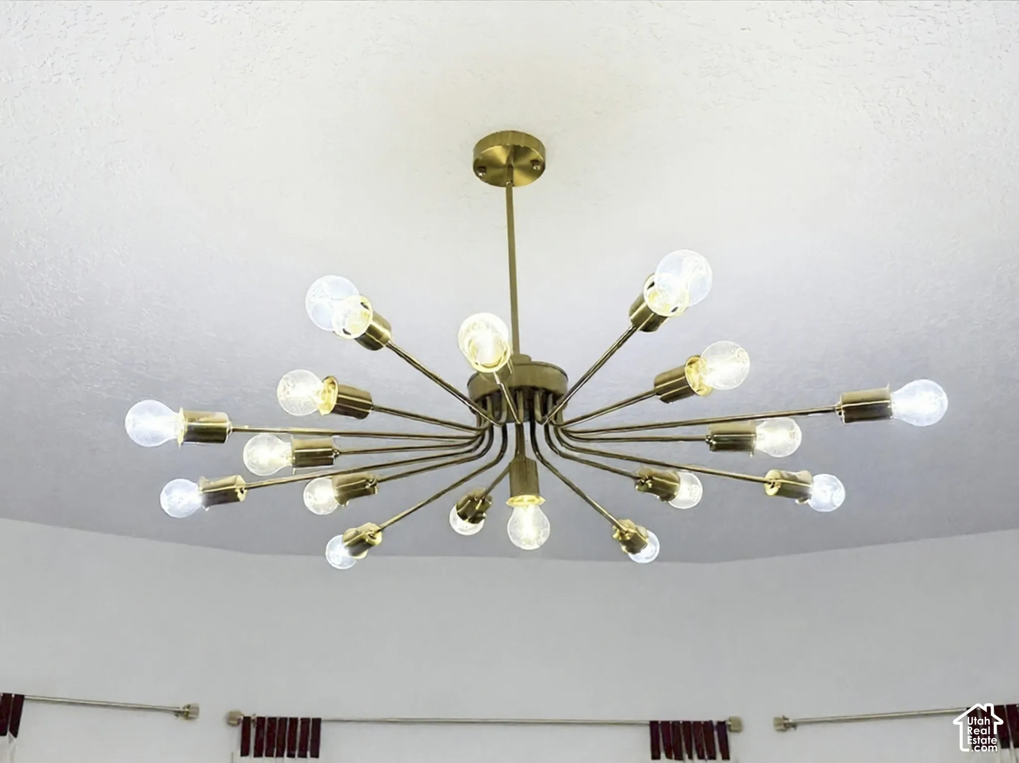 Modern multi-arm sputnik-style chandelier with brass finish