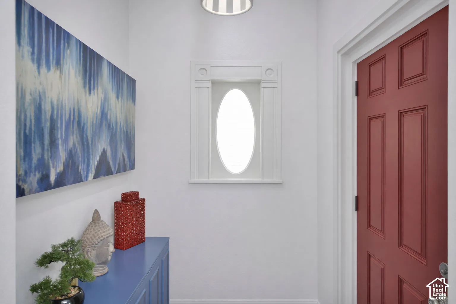 Red paneled door with white trim