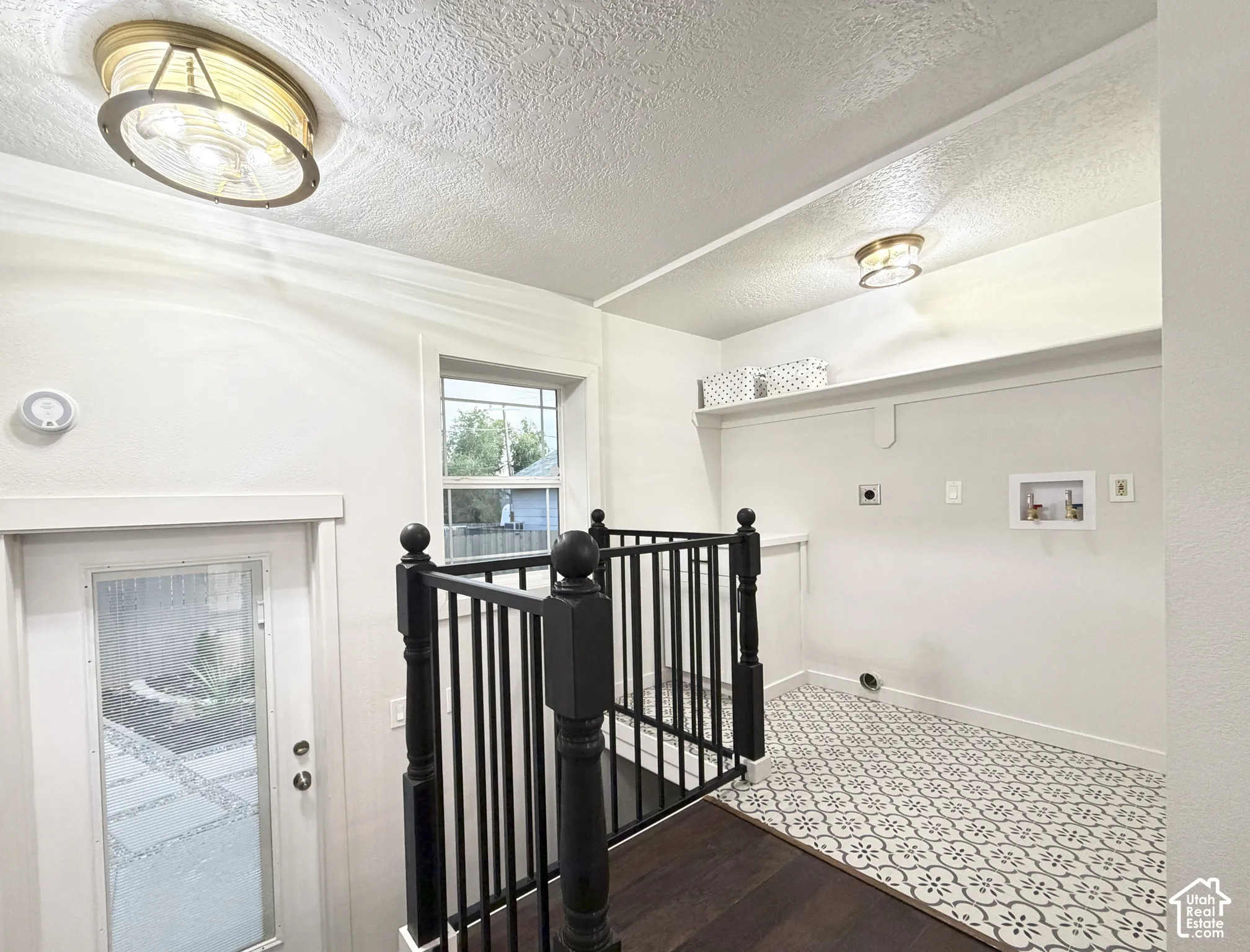 Convenient laundry area with mud room.