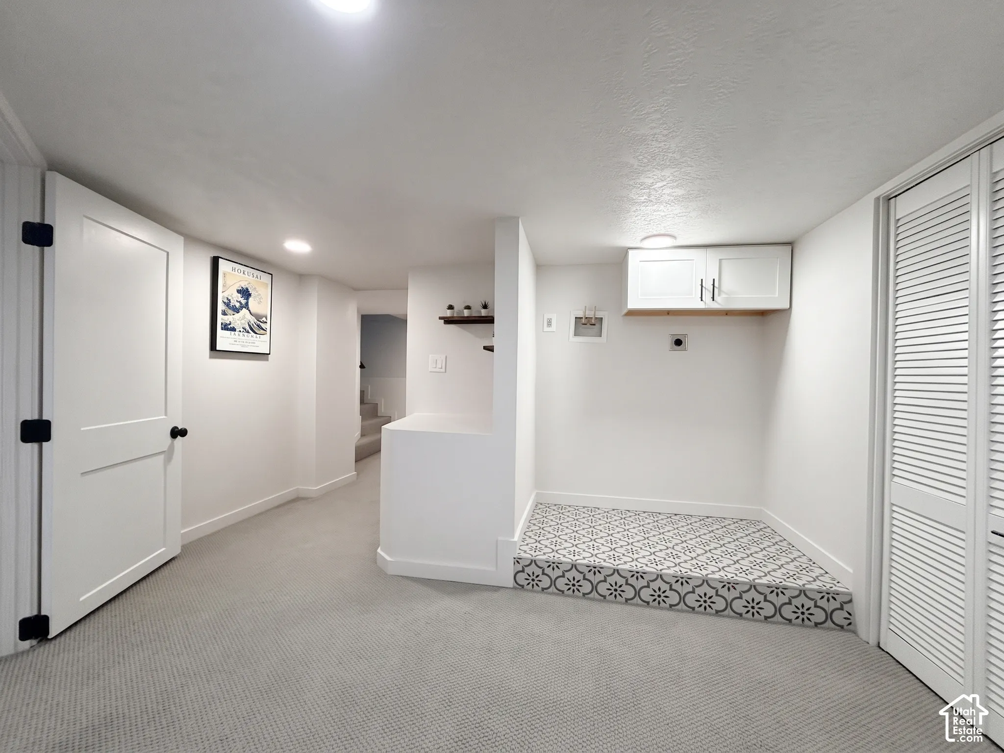 Lower level laundry area. Home offers two laundry rooms with full side-by-side hookups.