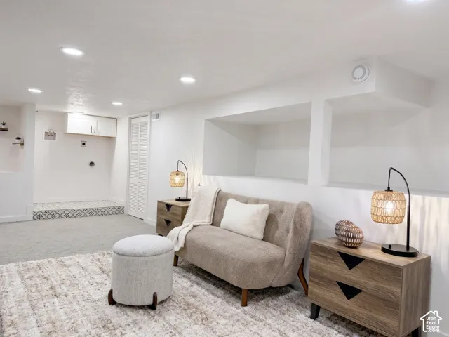Apartment in basement. Recessed ceiling lighting, built-in shelving and laundry room.