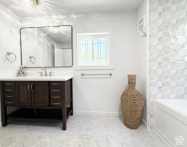 Dark wood-finish vanity with a white countertop and rectangular sink