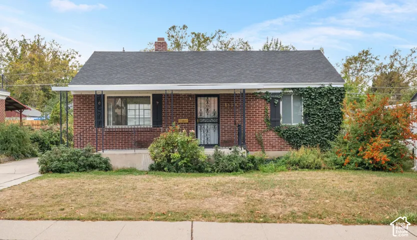 Brick exterior with a gabled roof and a covered porch