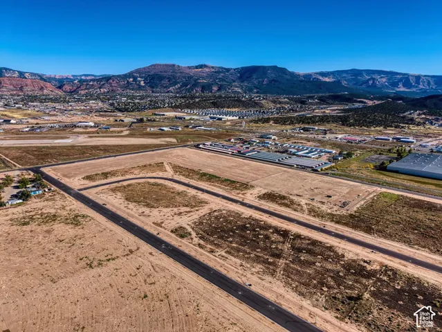 Expansive land parcel featuring established roads and distinct lot divisions
